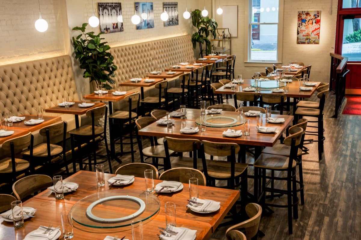 The main dining room at Sofia, set for service