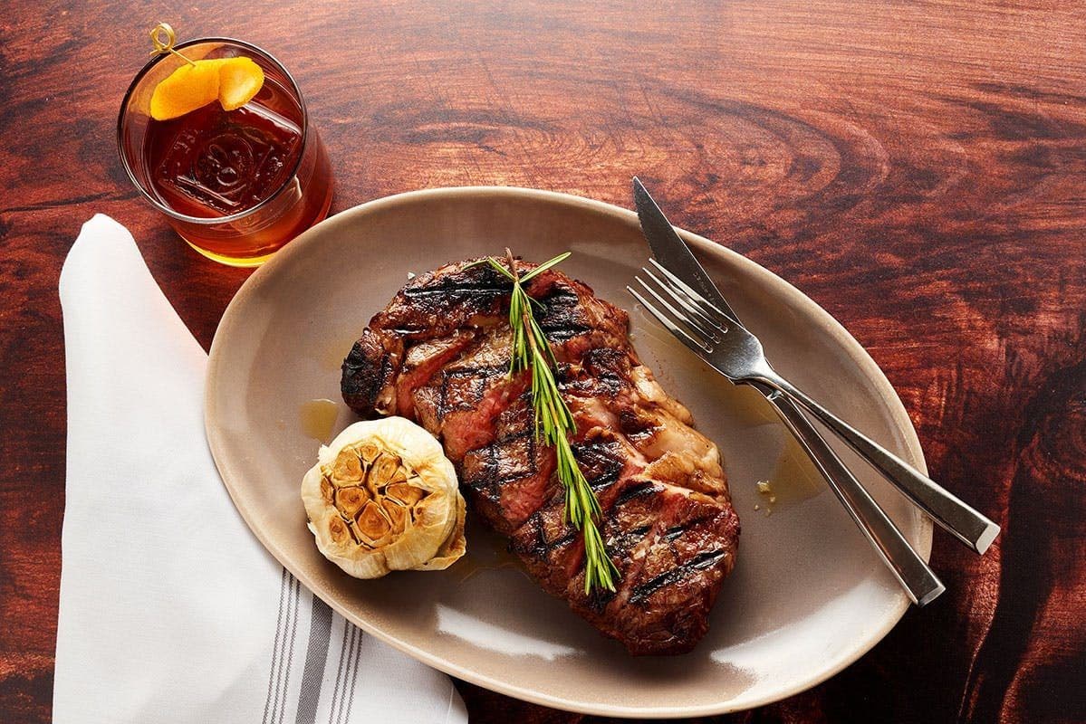 Grilled steak with roasted garlic at Sofia